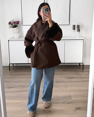 Manteau manches fourrure